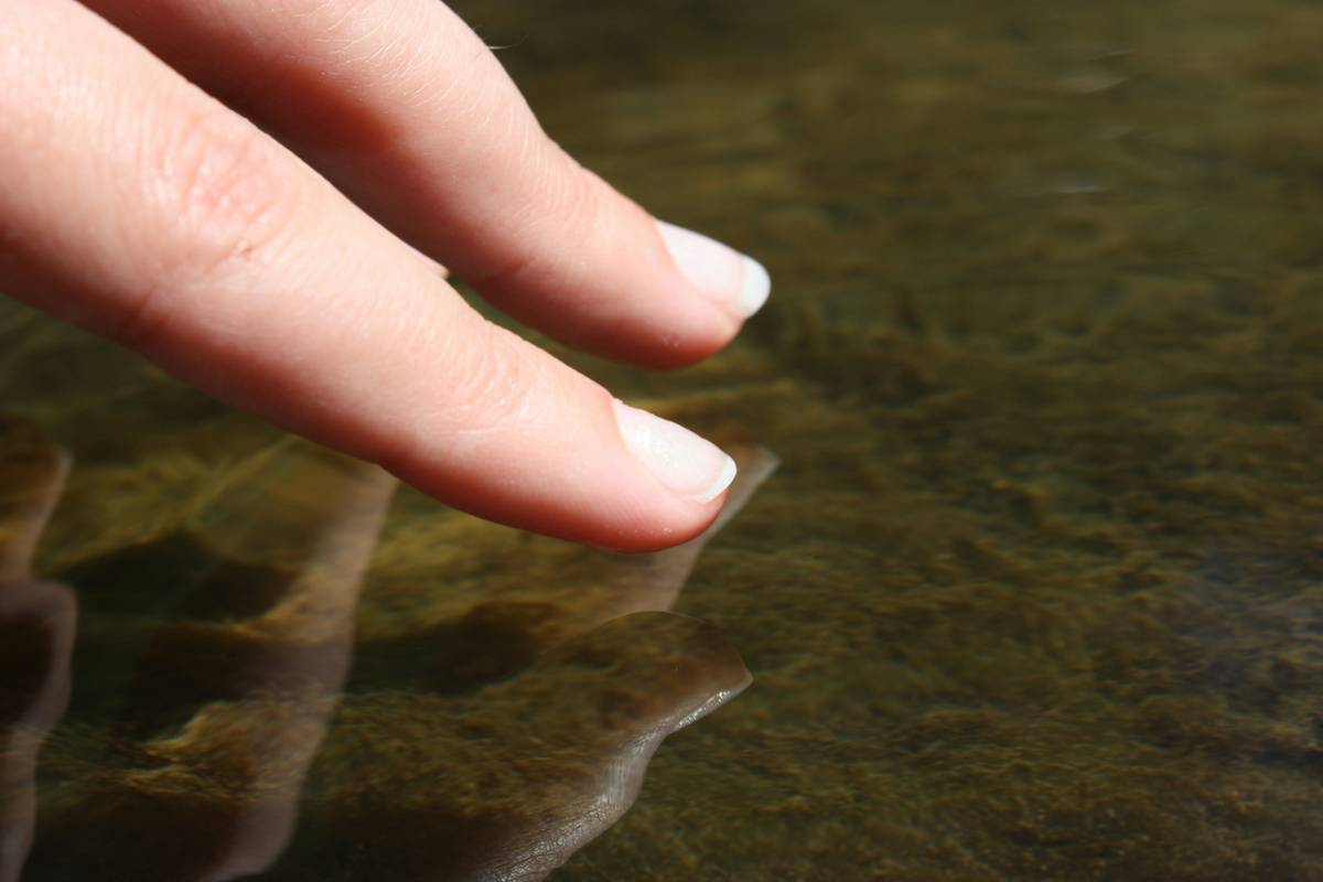 Close-up of clean, hydrated nails with visible cuticle and no polish residue, illustrating proper nail surface prep